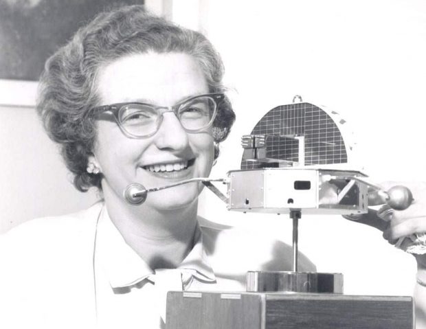 Nancy Grace Roman displays a model of Orbiting Solar Observatory-1 in 1962. (NASA)