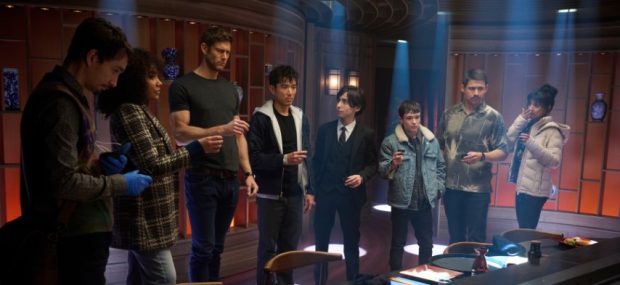 The Umbrella Academy. (L to R) Robert Sheehan as Klaus Hargreeves, Emmy Raver-Lampman as Allison Hargreeves, Tom Hopper as Luther Hargreeves, Justin H. Min as Ben Hargreeves, Aidan Gallagher as Number Five, Elliot Page as Viktor Hargreeves, David Castañeda as Diego Hargreeves, Ritu Arya as Lila Pitts in episode 401 of The Umbrella Academy. Cr. Christos Kalohoridis/Netflix © 2024